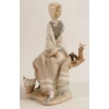 Lladro figure Of Young Girl Seated on Branch with Bird, height 24cm