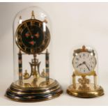 Kundo glass domed mantle clock with instructions and key, together with a smaller Koma domed