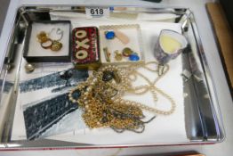 A collection of Costume Jewelry including, breads, chains, earrings etc