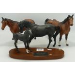 Beswick matte horses, comprising black beauty and foal and two brown horses. (small nip to ear of