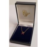 9ct gold hallmarked pendant set rubies & diamond, on a 9ct gold neck chain. Gross weight 1.4g, chain