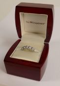 Gem Diamonds 5 stone ring set with white stones that are superior 'diamond copies', ring size S,