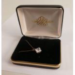 9ct gold pendant set large CZ or similar stone, and a 45cm long 9ct gold chain. Gross weight 1.8g.