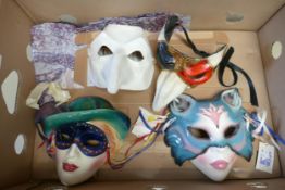 A collection of face masks: including two "Clay Art" face masks of ladys, Pulcinella and