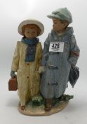 Lladro double figure group Boy and girl in raincoats: impressed number 2249, h.27.5cm.