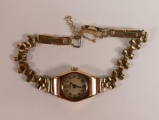 9ct gold hallmarked case record ladies wrist watch, winds and ticks. Bracelet rolled gold.