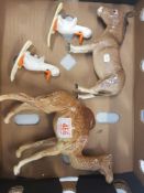 A collection of damaged Beswick items to include camel, donkey and 2 comical ducks on skis (4).