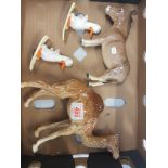 A collection of damaged Beswick items to include camel, donkey and 2 comical ducks on skis (4).