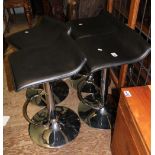 Four chrome and black vinyl breakfast bar type stools/seats (4).