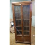 Edwardian mahogany glazed enclosed bookcase, leaded glass doors, raised on bun feet, 198cm H x