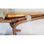 A group of 6 Vintage Hand carved walking sticks