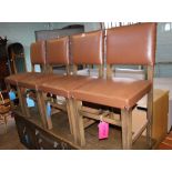 Set of 4 oak and leather dining chairs.