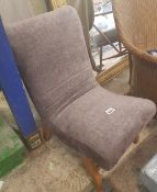 Small upholstered slipper chair.