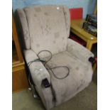 Fabric upholstered riser/recliner high-back armchair.