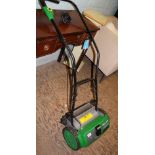 Gtech CM01 cordless cylinder lawn mower, used with charger.
