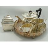 A collection of silver plated items to include tea service, gallery tray, tea caddy etc