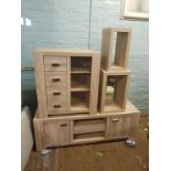 Matching limed oak effect furniture items including a low sideboard, chest of drawers unit and two