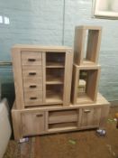 Matching limed oak effect furniture items including a low sideboard, chest of drawers unit and two