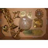 A collection of brassware items to include Chamber stick holder and shade, Brass Crib Board,
