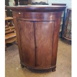 Mahogany corner cabinet, raised on bracket feet, 128cm H x 88cm W x 57cm D.