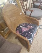 Lloyd Loom wicker tub chair with, Emma Shipley fabric to cushion.