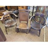 Oak early 2oth century nursing chair together with two non matching captains style chairs.