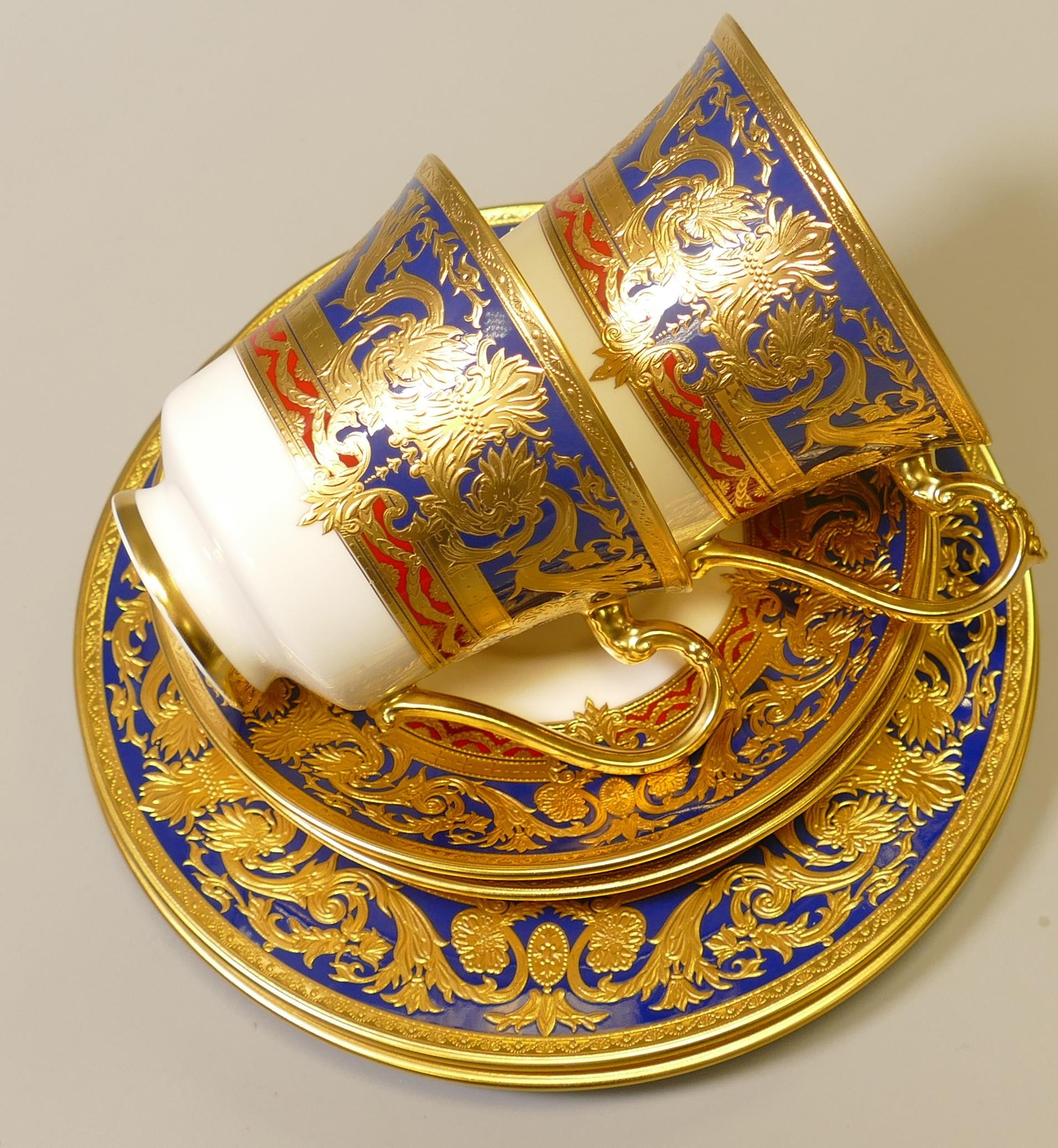 De Lamerie Fine Bone China heavily gilded Dark Blue Empress patterned trios, specially made high end