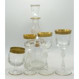 A large collection of Gilt Decorated Bohemian Glass ware including tumblers, decanters, large wine