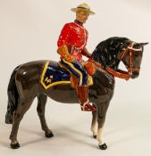 Beswick Canadian Mountie policeman on charcoal horse 1375, restored horses ear & riders boot.