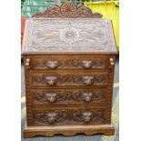 Victorian style Foliate carved bureau with lions head handles. H96cm x W74cm x D44cm.