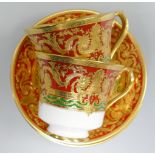 De Lamerie Fine Bone China heavily gilded Red/ Green Empress patterned cup / saucer sets,