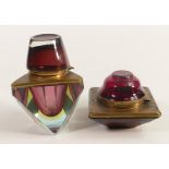 Heavy coloured glass inkwells with brass mounts, tallest 12cm. (2)
