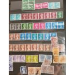 Three albums containing a large quantity of British mint and used stamps, together with some