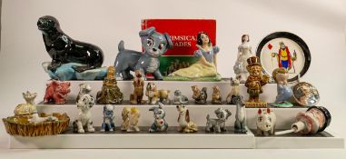 A good collection of Wade pottery including - Disney Whimsies, Disney Scamp blow up, Snow White