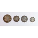 A collection of early silver coins to include George III 1762 threepence, James II twopence 1686,