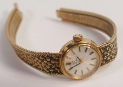 Ladies 9ct gold Omega wristwatch with strap, 18.1g. ticking order, end of catch missing.