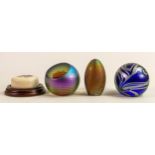 A collection of glass paperweights to include - Okra, signed egg shaped paperweight and a