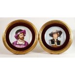 Pair of 19th century Berlin framed wall plaques decorated with portraits in period dress, marked