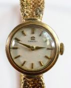 Ladies 9ct gold Omega wrist watch with 9ct gold bracelet, original box, papers and guarantee dated