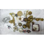 A collection of antique military & similar theme cap / lapel badges together with similar military