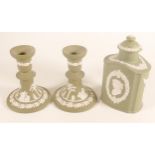 Wedgwood sage green candlesticks & tea caddy, height of tallest 16.5cm. (3)