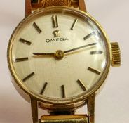 Omega ladies 9ct gold wristwatch, with expandable gold plated strap. Presentation inscription to