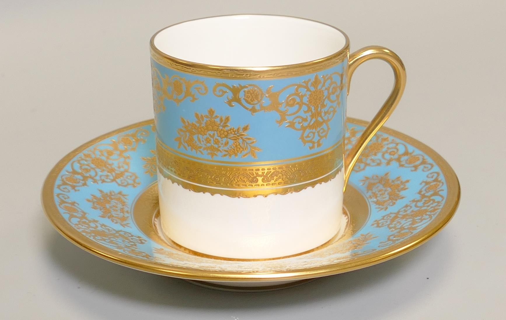 De Lamerie Fine Bone China heavily gilded Turquoise Exotic Garden patterned coffee can & saucer,