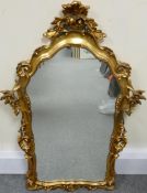 Gilt framed ornate wall mirror, height 102cm x width 68cm.