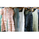 A collection of ladies vintage evening, cocktail, coat & girls summer dresses together with an