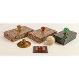 Three large marble paperweights together with a brass paperweight and similar items.