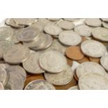 A collection of coins, including Royal Mint Guernsey two pound coin, two pre-1947 florins and a