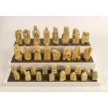 Hand carved Mythical theme soft stone chess set, some damage, 32 pieces, height of King 8.8cm, old