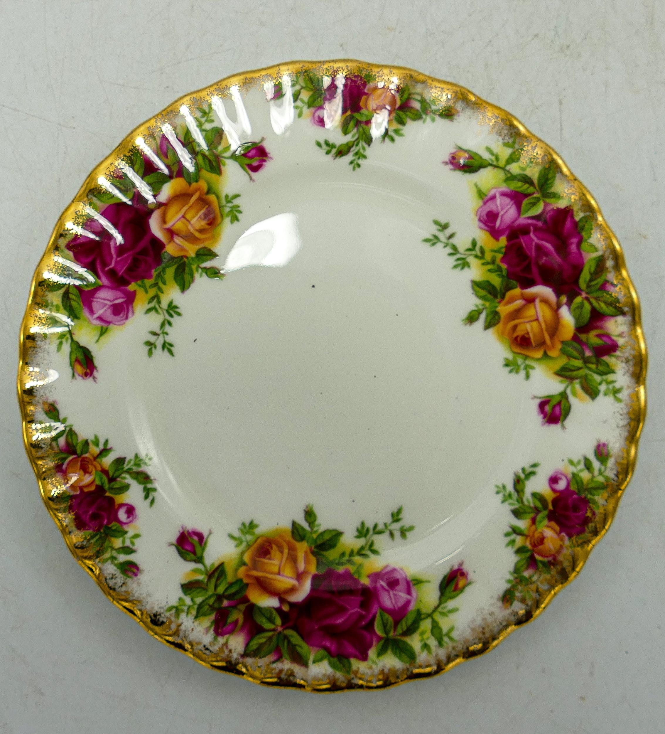 A large collection of Royal Albert Old Country Roses & Poinsettia patterned tea & dinner ware