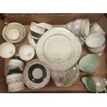 A collection of green & gilt decorated tea ware